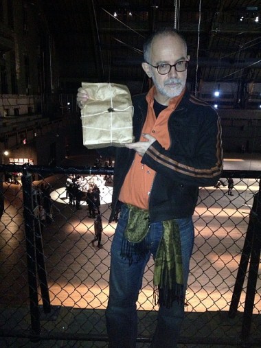 What they're reading into the microphones is broadcast to 42 transistor radios inside paper bags that the audience can carry anywhere in the space.