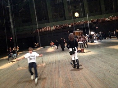 The curtain rises and falls and billows in response to the movements of audience members swinging on 42 swings hung from the ceiling.