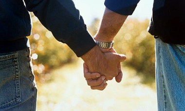 Two men holding hands