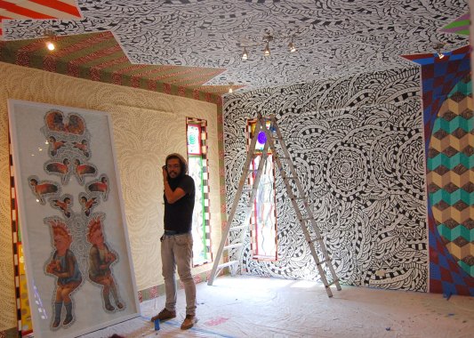 Agustin was just finishing the custom-painted backgrounds for his artwork